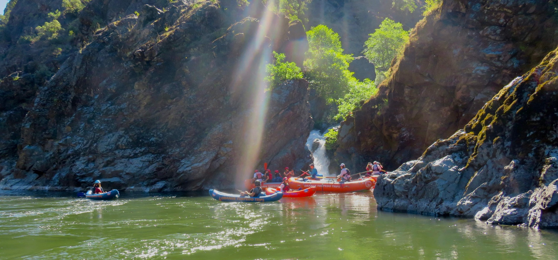 Group together on a guided Rogue River Trip at Stair creek falls