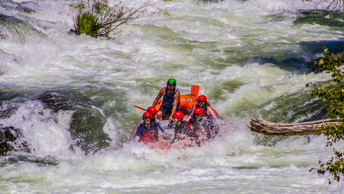 Group in the Bottom falls at Tilomikh Falls on the Rogue River in a raft