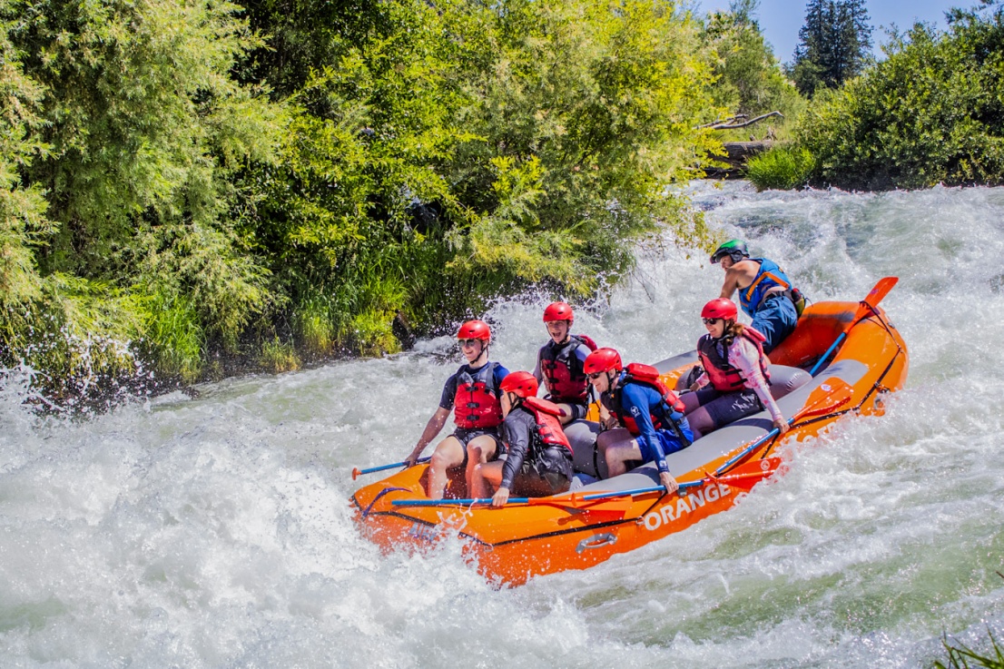 Guide taking screaming family into the biggest wave in Nugget Falls on the Rogue River